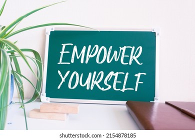 Empower yourself text on blackboard