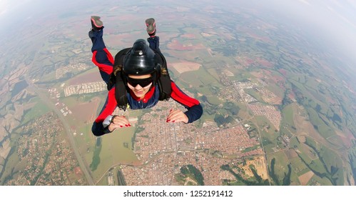 Empowered Woman Jumping From Parachute.