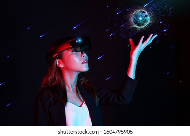 Empowered women in innovate modern technology - Young business girl trying mixed reality with hololens 1 - Virtual and Augmented reality concept.