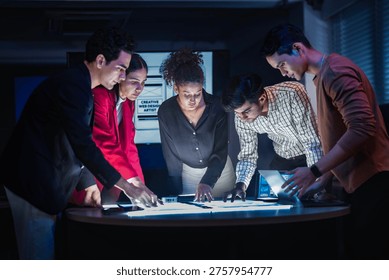 Empowering diverse STEM workforce. Engineering team analyzing interactive digital layouts. Driving creative app innovation in modern workspace.