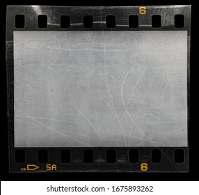 empty 35mm film strip snip isolated on black background with scratches and dust, cool photo placeholder for your vintage social media posting.