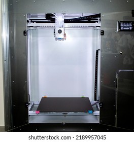 Empty 3d printer close-up. 3d printer with empty desktop inside. Non-printing open 3dprinter. Cope space. Progressive additive modern 3D printing technology. High-precision 3D printing technologies