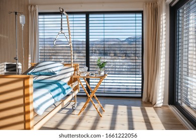 Empty, Adjustable Bed In Room In Private Modern Hospital.