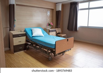 Empty Adjustable Patient Bed With Saline Solution In Private Room At Hospital Ward