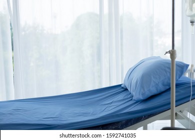 Empty adjustable patient 's bed in hospital room. An adjustable bed is for patient who admitted to hospital for medical treatment and rehabilitation. Health care insurance coverage & P.A. concept.  
