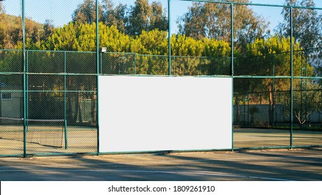 Empty Advertising White Banner With Mockup On Iron Fence On Sport Playground Front View