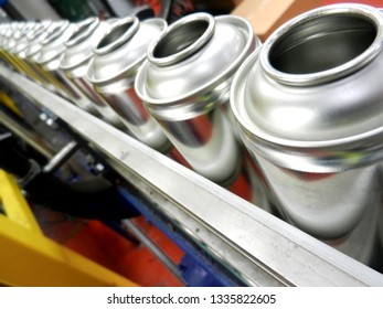 Empty Aerosol Cans Awaiting Filling In Production Factory