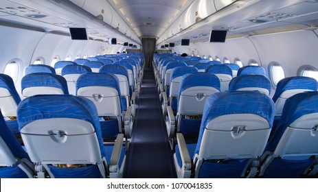 Empty Aircraft Cabin During Flight. Blue Salon.