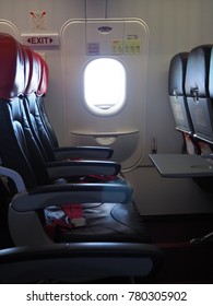 Empty Aircraft Seats Which Color Red Seat In Airasia Airplane Is A Hot Seat And Nearing With The Emergency Exit Door. 