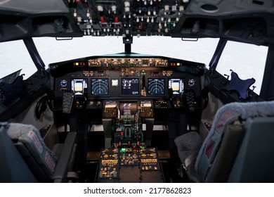 Empty Airplane Cockpit With Electronic Flying Navigation Panel, Control Command With Buttons And Lever On Dashboard. No People In Aircraft Cabin To Throttle Engine And Takeoff.