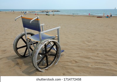 Empty Aluminum Wheelchair On The Beach