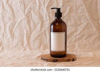 Empty amber glass soap or shampoo bottle on isolated background. Skin care or hair concept with natural cosmetics. - Powered by Shutterstock