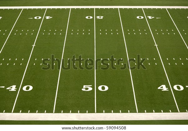 Empty American football field showing 40 and 50
yard lines
