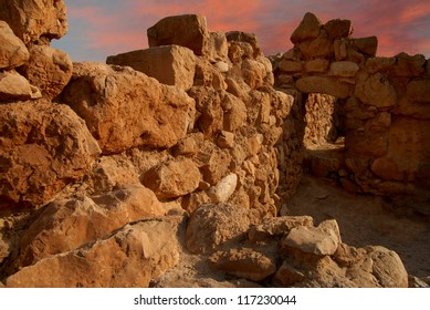 An empty ancient ruins in Qumran National Park near the Dead Sea, Israel isolated against beautiful dramatic sunset sky background.No people. Copy space