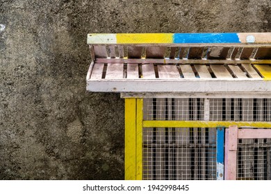 An Empty Animal Cage With Cement Wall Background