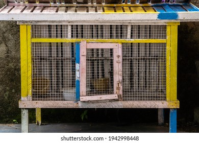 An Empty Animal Cage With Cement Wall Background