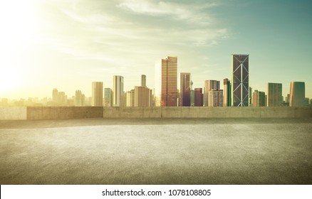 Empty Asphalt Carpark With Modern City Skyline , Morning Sunrise Scene .