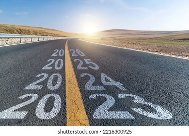 Empty asphalt highway with number 2023, 2024, 2025 and 2026 - Shutterstock ID 2216300925