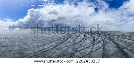 Empty asphalt race track road with sky clouds background. panoramic view.