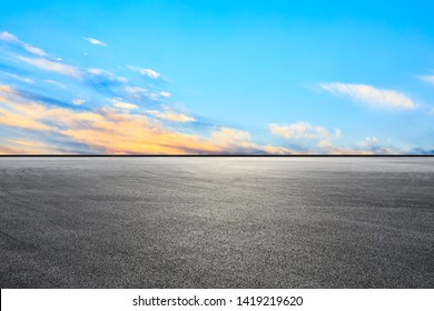 Empty Asphalt Race Track And Sunset Sky