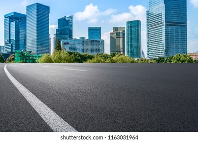 Empty asphalt road along modern commercial buildings in China's  - Shutterstock ID 1163031964