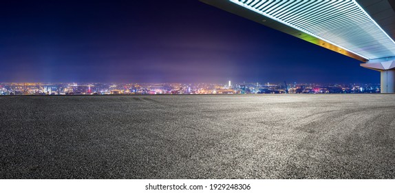 Empty Asphalt Road And Bridge With City Skyline At Night In Shanghai.