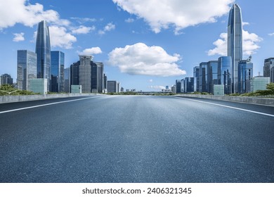 Empty asphalt road and city buildings skyline in Shenzhen