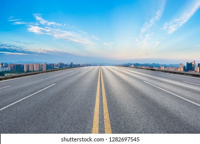 Empty Asphalt Road And City Skyline At Sunrise In Hangzhou,high Angle View