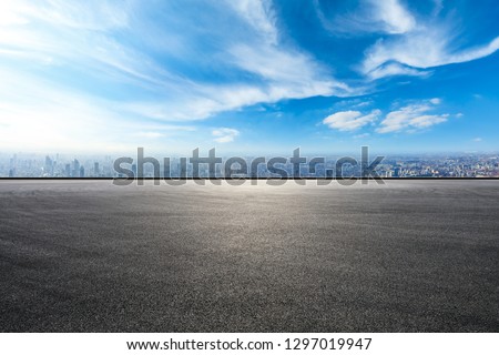 Empty asphalt road and city skyline in Shanghai,high angle view