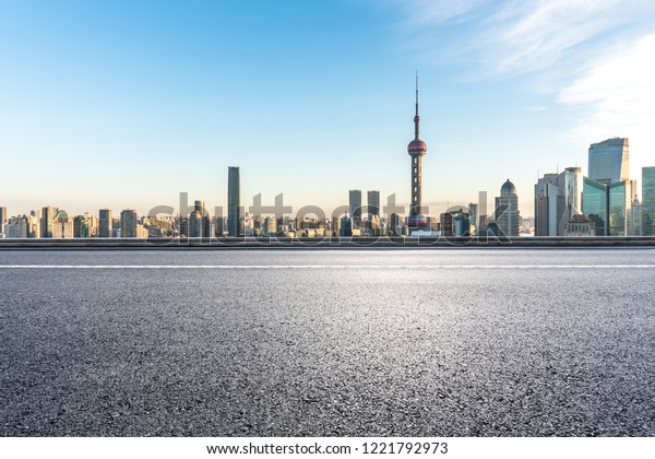 empty\
asphalt road with city skyline in shanghai\
china