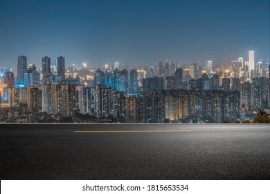 empty asphalt road in downtown of modern city  at night. - Shutterstock ID 1815653534