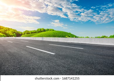 Empty Asphalt Road And Green Tea Plantation Nature Landscape.