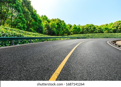 Empty Asphalt Road And Green Tea Plantation Nature Landscape.