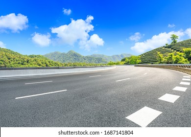 Empty Asphalt Road And Green Tea Plantation Nature Landscape.