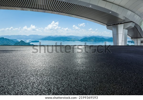Empty\
asphalt road and mountain with bridge\
background