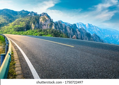 Empty Asphalt Road And Mountain Natural Scenery On A Sunny Day.