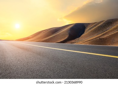 Empty asphalt road and mountain natural landscape at sunset - Powered by Shutterstock