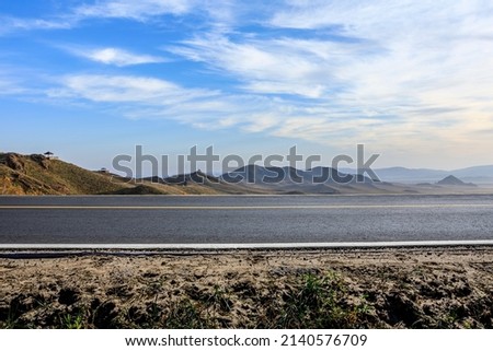 Empty asphalt road and mountain nature landscape under blue sky