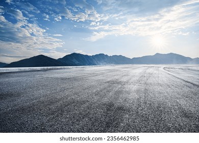 Empty asphalt road and mountains nature scenery at sunrise - Powered by Shutterstock