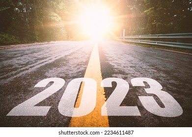 Empty asphalt road with New year 2023 concept. Direction to new year concept and sustainable development idea for goal and success. - Shutterstock ID 2234611487