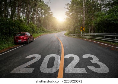 Empty asphalt road with New year 2023 concept. Direction to new year concept and sustainable development idea for goal and success. - Shutterstock ID 2235020591