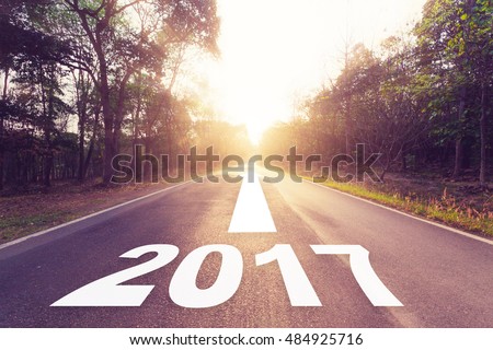 Empty asphalt road and New year 2017 concept.