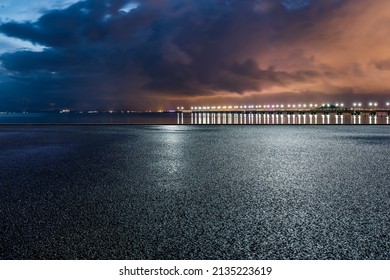 Empty asphalt road platform and clouds scenery at night
