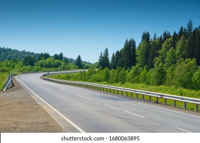 Empty Asphalt Road With Sharp Turn