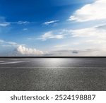 Empty asphalt road and sky clouds background