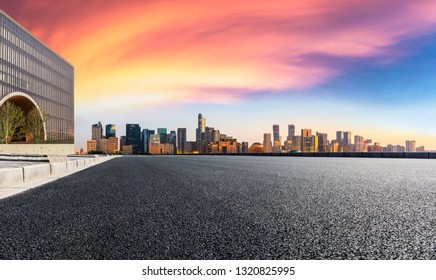 Empty asphalt road through Hangzhou business district - Shutterstock ID 1320825995