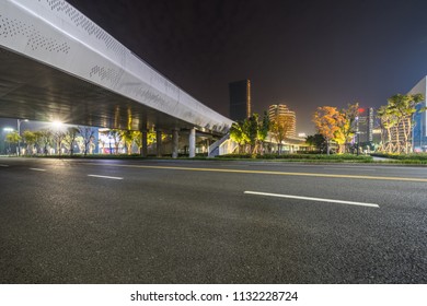 Empty Asphalt Road Through Modern City At Night, China