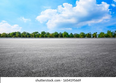 Empty asphalt road and woods background landscape