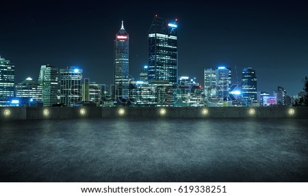 Empty asphalt roof top with modern city skyline , night scene ,Perth , Australia .