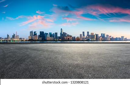 Empty asphalt square ground and Hangzhou business district cityscape - Shutterstock ID 1320808121